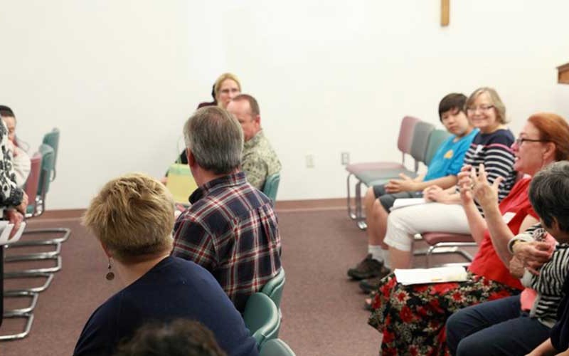 Franciscan Sister Maureen Colleary listens to an audience member during a presentation last month at Holy Family Cathedral in Anchorage.