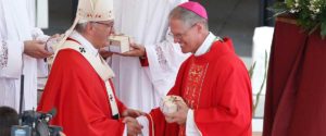 Pope Francis hands pallium to Archbishop Etienne on Feast of Sts. Peter & Paul